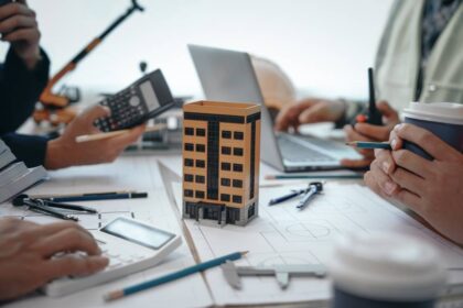 Skilled,Team,Of,Engineers,Collaborates,In,Meetings,,Drafting,Blueprints,For HOA Legal Insights