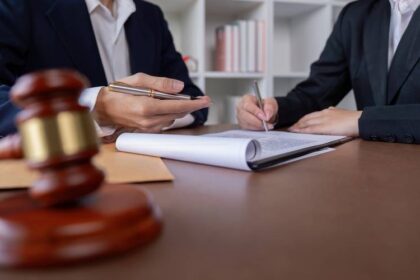 Professional,Lawyer,Signing,Business,Contract,With,Client,In,Office,,Legal HOA Attorney Santa Clara County